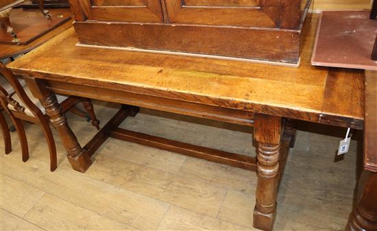 A 17th century style oak refectory dining table L.164cm